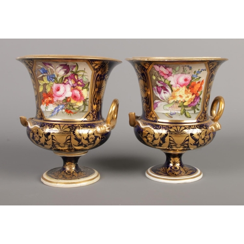 19 - An early 19th century Derby campana shaped garniture. Cobalt ground with painted floral panels and g... 