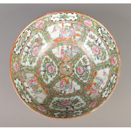 2 - A large Chinese Cantonese bowl. Decorated in coloured enamels with foliage and panels depicting figu... 