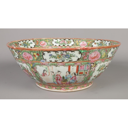 2 - A large Chinese Cantonese bowl. Decorated in coloured enamels with foliage and panels depicting figu... 