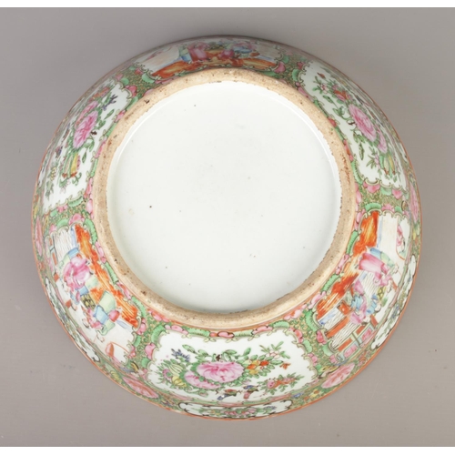 2 - A large Chinese Cantonese bowl. Decorated in coloured enamels with foliage and panels depicting figu... 