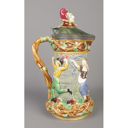 20 - A 19th century Minton majolica pottery Jester Tower jug. With moulded decoration and pewter mounted ... 