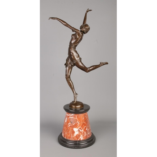 37 - After Bruno Zach (1891-1945), an Art Deco style bronze figure of a dancing girl raised on marble pli... 