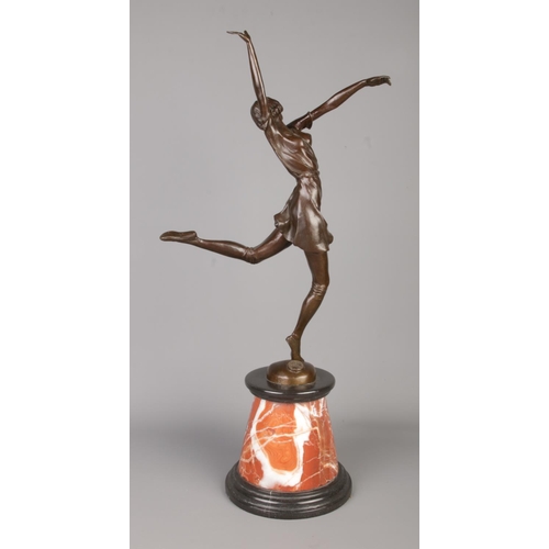 37 - After Bruno Zach (1891-1945), an Art Deco style bronze figure of a dancing girl raised on marble pli... 