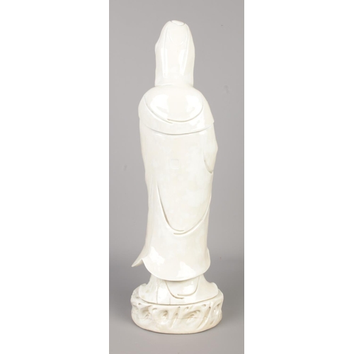 4 - A Chinese blanc de chine figure of Guanyin. Having impressed seal mark to back. Height 44cm.