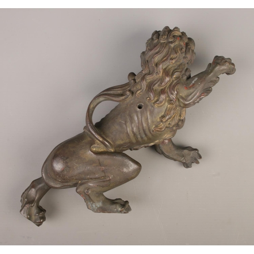 40 - A bronze casting pattern for a rearing lion, possibly of Chinese style. Length 31cm.