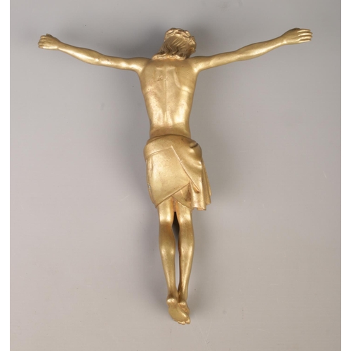 41 - A gilt cast metal Corpus Christi figure. Length 29.5cm.