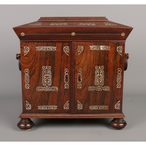 45 - An early Victorian rosewood table top sewing cabinet with mother of pearl inlaid decoration. Having ... 