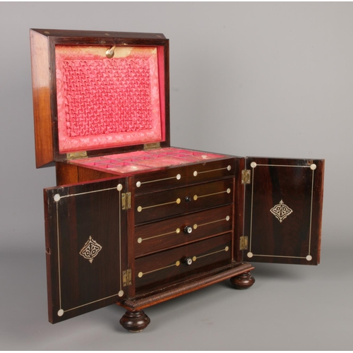 45 - An early Victorian rosewood table top sewing cabinet with mother of pearl inlaid decoration. Having ... 