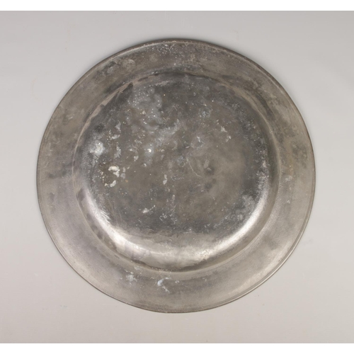 46 - A large pewter charger. Bearing touch marks, AK and stamped Master John Briggs to the back. Diameter... 