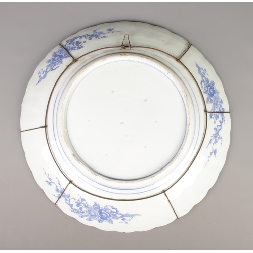 5 - A large Chinese blue and white charger decorated with birds and flowers. Diameter 47.5cm.