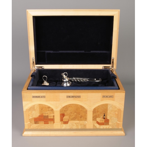 52 - A marquetry sommelier chest with contents of hallmarked silver wine accessories. Includes Chateau La... 