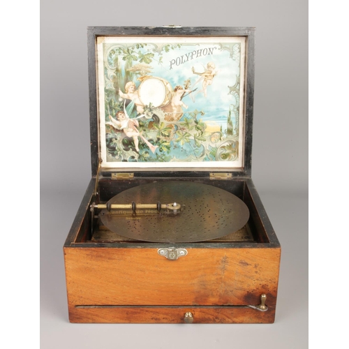 53 - A late 19th century polyphon disc music player. With twenty discs.