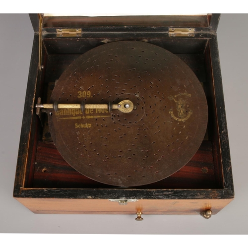 53 - A late 19th century polyphon disc music player. With twenty discs.