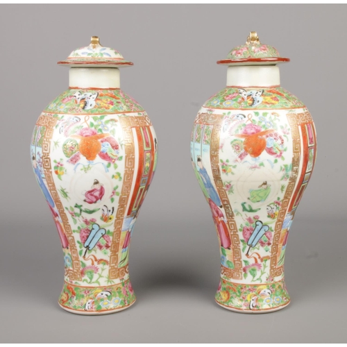 6 - A pair of Chinese famille rose lidded baluster vases. Height 28.5cm.