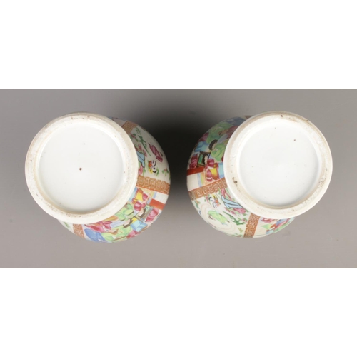 6 - A pair of Chinese famille rose lidded baluster vases. Height 28.5cm.