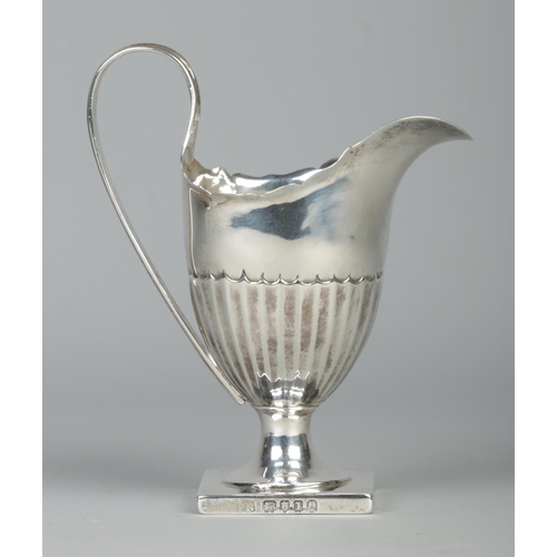 67 - A George III helmet shaped silver cream jug. Assayed London 1786 by Philip Norman. Height 14cm. 123g... 