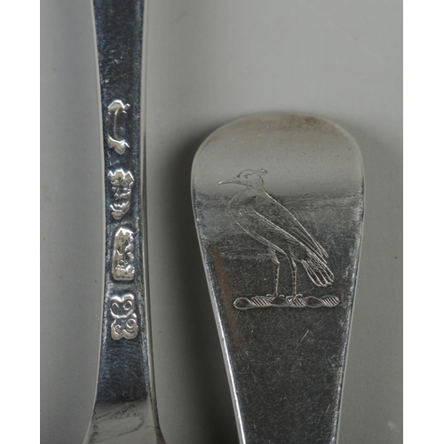 72 - A pair of George II Hanoverian pattern silver table spoons. Both bearing bird motifs to back of hand... 