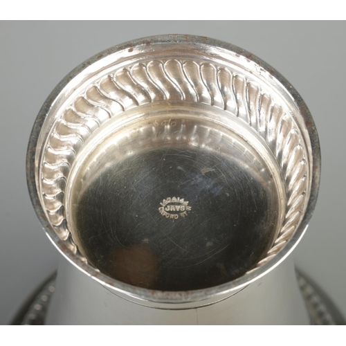 74 - An Edward VII silver vase of tapering form. Assayed Chester 1906 by Jay, Richard Attenborough Co Ltd... 