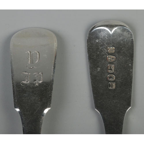 75 - A pair of George IV silver fiddle pattern table spoons. Both monogrammed. Assayed Newcastle 1823 by ... 