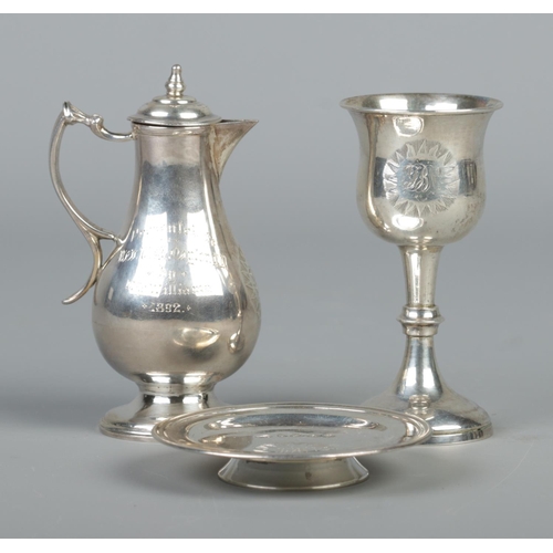 77 - A cased Victorian silver three piece communion set. Monogrammed and presented to Reverend TB Naylor.... 