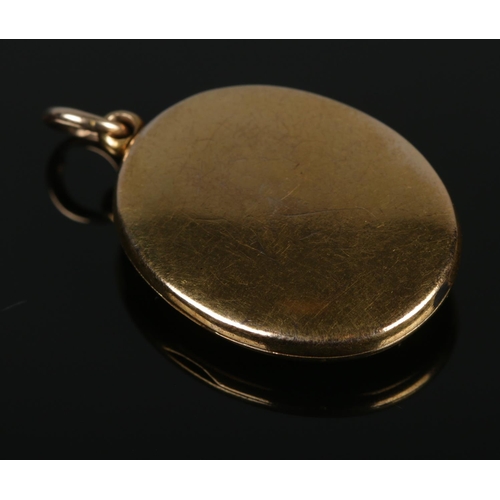 93 - A Victorian 15ct yellow gold mourning locket pendant. Gross weight 6.83g.