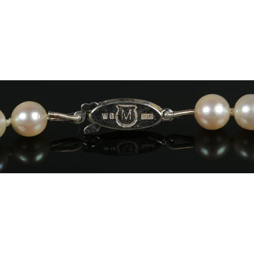 99 - A string of Mikimoto cultured pearls with 10ct white gold clasp. Length approximately 16inches.