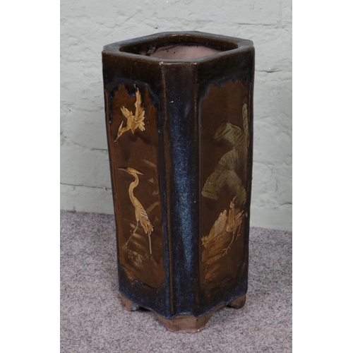 284 - A 1920s vintage Chinese concrete umbrella stand, featuring a glazed ceramic bird scene. Square form ... 