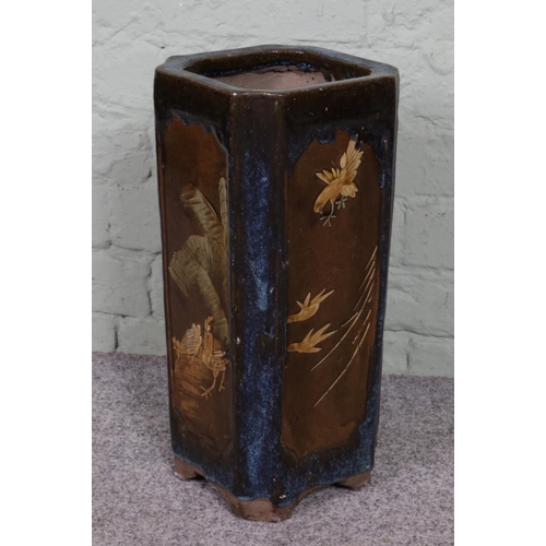 284 - A 1920s vintage Chinese concrete umbrella stand, featuring a glazed ceramic bird scene. Square form ... 