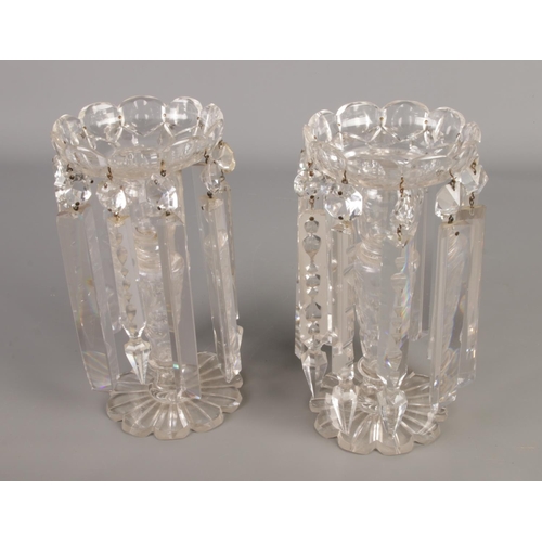 168 - A pair of antique cut glass table lustre candlesticks. Height 23cm, width 13cm.