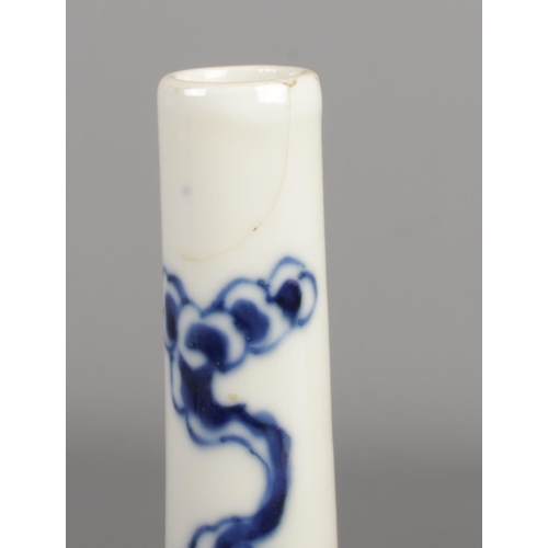 170 - A Chinese blue and white bottle vase. Decorated with a Phoenix amongst clouds. Height 22.5cm.