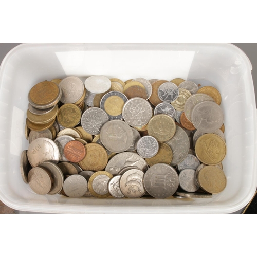 178 - A box containing world coinage and notes, featuring a selection of pre-decimal coins.