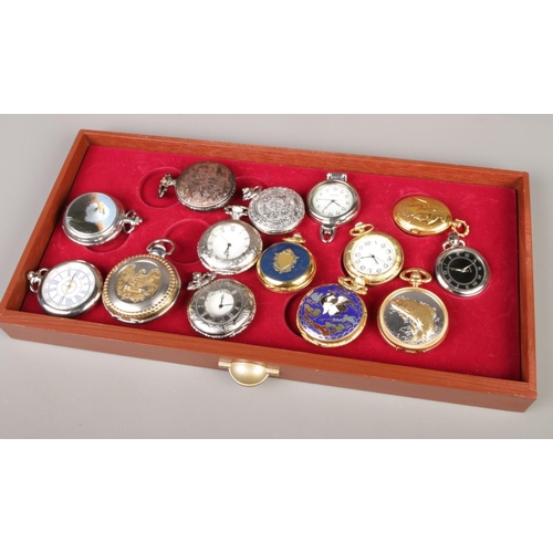 184 - A collection of quartz pocket watches housed in a three-drawer wooden watch case.