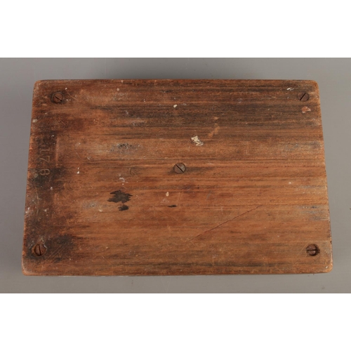 195 - An antique wooden money tray with five recesses.