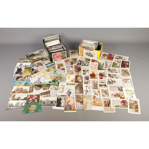 199 - Two boxes containing a large quantity of assorted vintage postcards, greetings cards and photographs... 