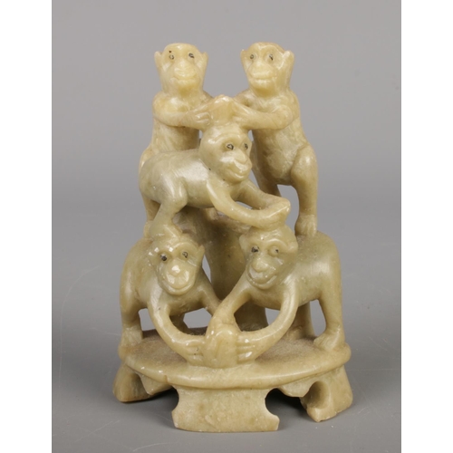 213 - A collection of seven Chinese soapstone ornaments, intricately hand carved with floral designs and a... 