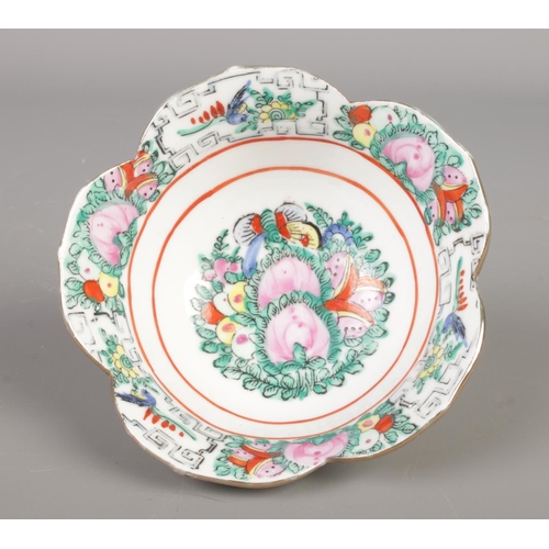 216 - An antique Chinese famille rose ginger jar paired with a famille rose floral porcelain bowl.