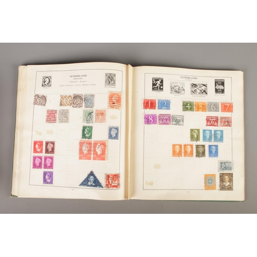 269 - Philatelist interest; A Strand stamp album with contents of world stamps, Scott's Standard Postage S... 