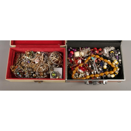 285 - Two jewellery boxes containing a good collection of costume jewellery. To include amber coloured bea... 