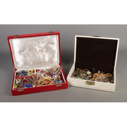 289 - Two jewellery boxes containing costume jewellery. Includes coloured glass set bangle, dress rings, n... 