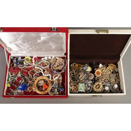 289 - Two jewellery boxes containing costume jewellery. Includes coloured glass set bangle, dress rings, n... 