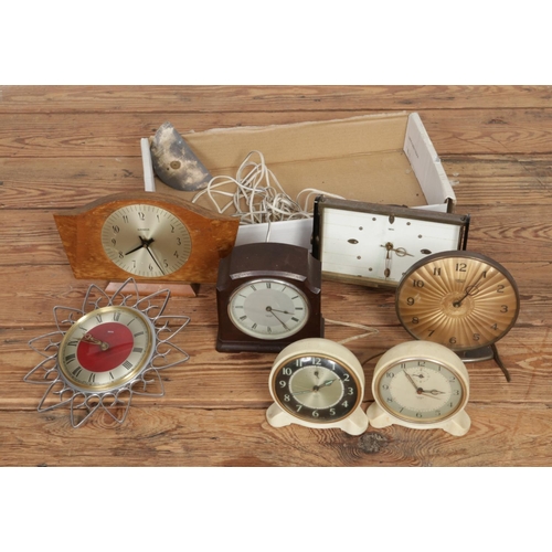 300 - A collection of vintage clocks including mostly Smiths examples with one Kienzle example.