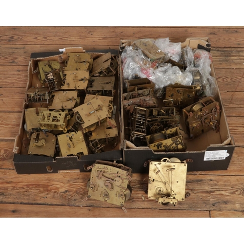 302 - Two boxes of assorted mantle clock movements with examples including Smiths & Enfield