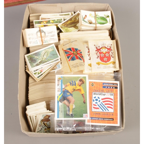 326 - A large collection of assorted cigarette cards, trade cards, silk cigarette cards, albums and a fram... 