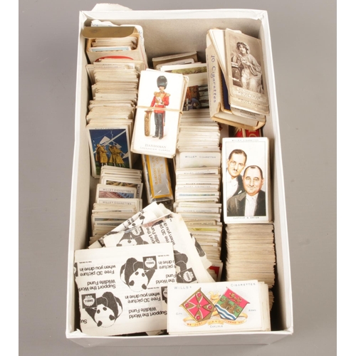 326 - A large collection of assorted cigarette cards, trade cards, silk cigarette cards, albums and a fram... 