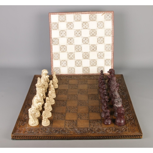 370 - A complete composite chess set with carved board along with a tile top example.