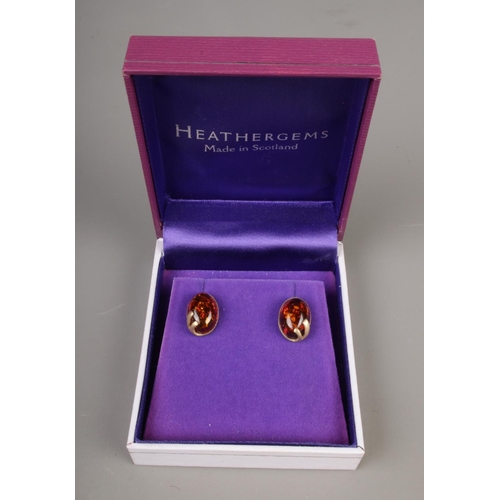 406 - A pair of 9ct gold and amber earrings.