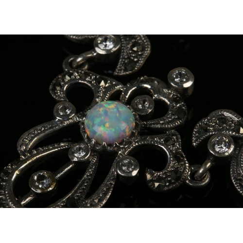 417 - A silver opal necklace with matching opal earrings.