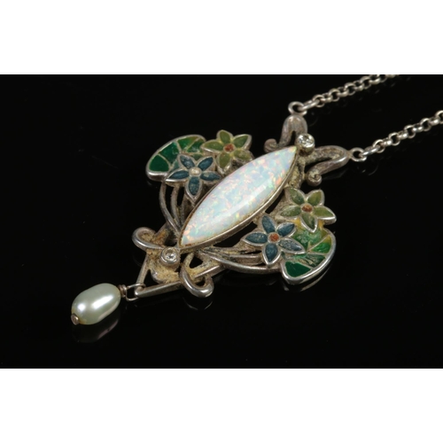 418 - An Arts & Crafts Opal silver pendant necklace, it's a combination of an opal with a enamel floral de... 