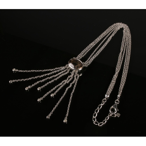 422 - A collection of two silver necklaces: a smokey Quartz pendant necklace with multiple chains and dang... 