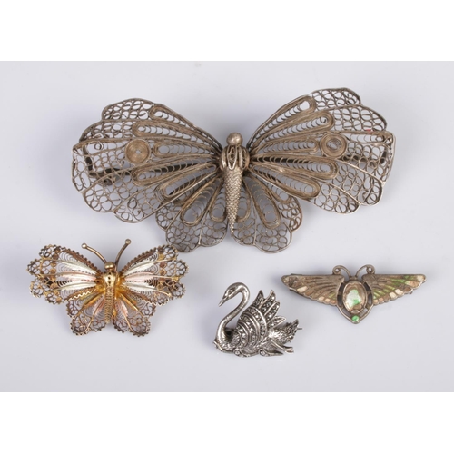 437 - Three silver butterfly brooches, along with a marcasite set swan brooch. Contains a large filigree a... 